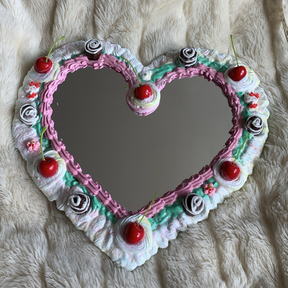 Heart shaped candy cake  mirror with chocolates and cherries